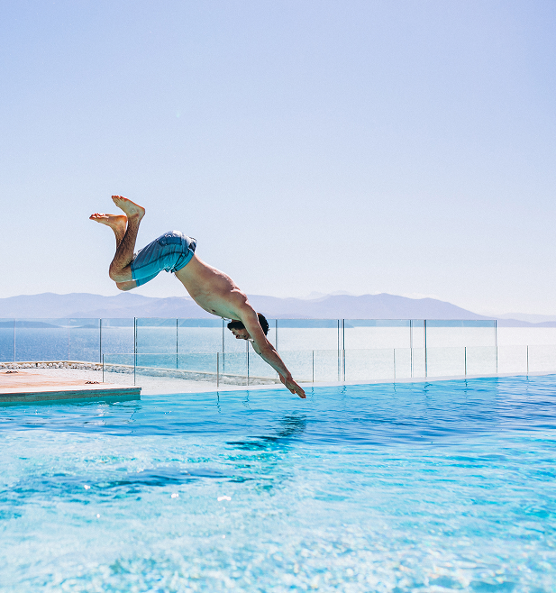 man-jumpinhg-into-pool 1